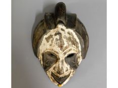 An African tribal art carved mask, 11in high x 8in