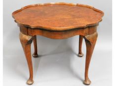 A low level occasional table with burr walnut vene