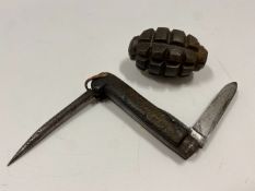 A WW2 hand grenade twinned with an antique army po
