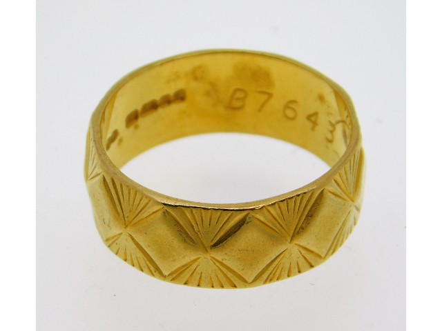 A 22ct gold band, size O/P, 6.45g