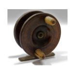 A vintage wooden & brass fishing reel, split to on