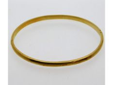 A 14ct gold bangle, 66mm internal measurement at w