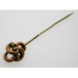 A Victorian yellow metal knot pin, electronically