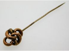 A Victorian yellow metal knot pin, electronically