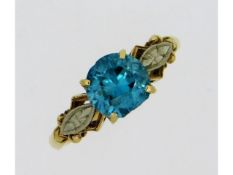 A 14ct gold ring set with zircon & 10ct mounted di