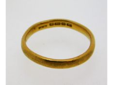 A 22ct gold band, size O, 3.5g