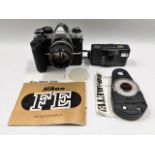 A Nikon FM2 35mm camera with battery grip & 85mm l