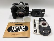 A Nikon FM2 35mm camera with battery grip & 85mm l