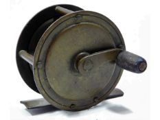 A vintage brass fishing reel, 51mm diameter