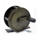 A vintage brass fishing reel, 51mm diameter