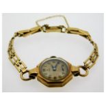 A ladies 9ct gold cased Tudor with rolled gold str