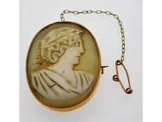 A yellow metal mounted cameo, electronically tests
