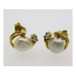 A pair of 9ct gold earrings set with diamond & bar