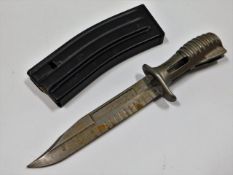 A British SA80 bayonet twinned with a rifle magazi