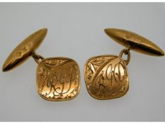 A pair of 9ct gold cuff links, some bumps, monogra