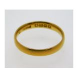 A 22ct gold band, size M, 2.68g