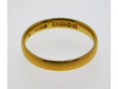 A 22ct gold band, size M, 2.68g