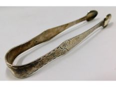 A Georgian bright cut pair of silver sugar tongs,