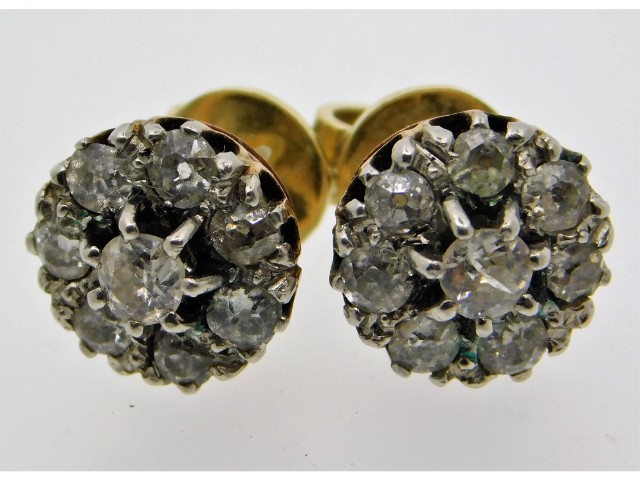 A pair of early 20thC. yellow metal old cut diamon