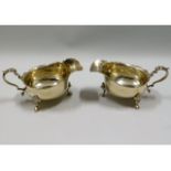 A pair of 1937 London silver gravy boats by Goldsm