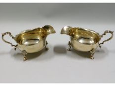 A pair of 1937 London silver gravy boats by Goldsm