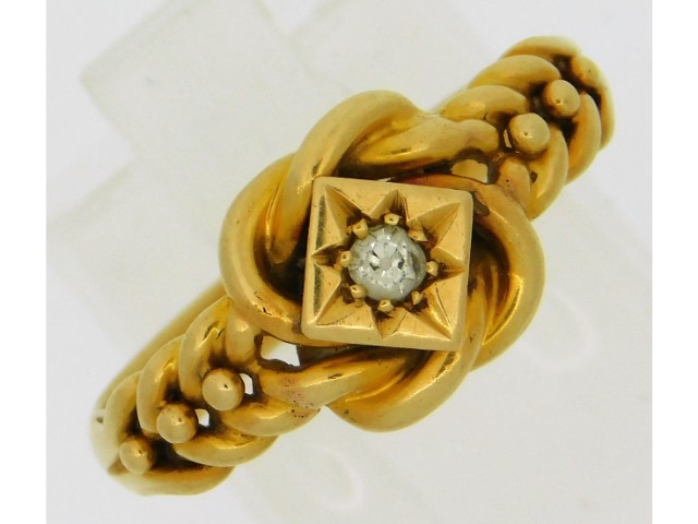 A 1913 18ct gold ring set with small diamond by So