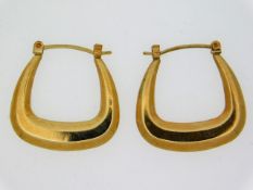 A pair of yellow metal earrings, electronically te