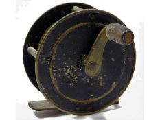 A vintage brass fishing reel, 57mm diameter
