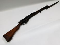 An Enfield rifle with bayonet, marked SHT LE Cond