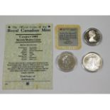 Three silver collectors coins, one with certificat