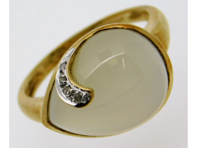 A 9ct gold ring set with diamond & pear shaped moo