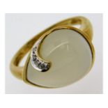 A 9ct gold ring set with diamond & pear shaped moo