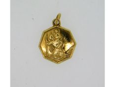 A 9ct gold St. Christopher pendant, 12mm diameter,