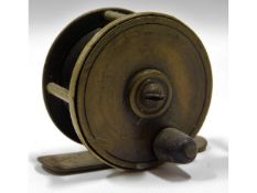 A vintage brass fishing reel, 51mm diameter