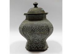 An antique Chinese bronze pot & cover with decorat