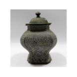 An antique Chinese bronze pot & cover with decorat