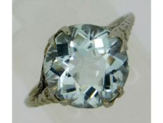 A white metal aquamarine ring, electronically tests as 18ct white gold, stone 11mm diameter x 7mm de