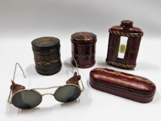 Two early 20thC. leather cased cigarette holders,