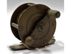 A vintage brass fishing reel, 50.5mm diameter