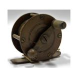 A vintage brass fishing reel, 50.5mm diameter