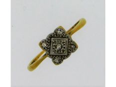 An early 20thC. 18ct gold ring with five small pla