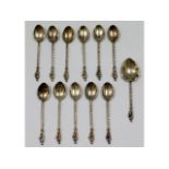 A collection of white metal spoons, test as silver