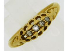 An antique 18ct gold ring set with four small diam