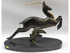 An art deco style bronze antelope on marble plinth