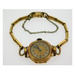 A 9ct gold cased ladies wristwatch with gold plate