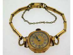 A 9ct gold cased ladies wristwatch with gold plate