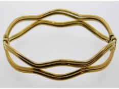 A 9ct gold bangle, 62mm internally at widest, 13.6