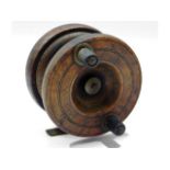 A vintage walnut & brass fishing reel, 75mm diamet