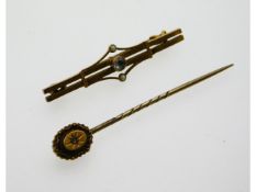 A 9ct gold tie pin set with small diamond twinned