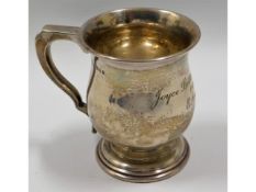 A silver christening mug by Kemp Bros. London, ins